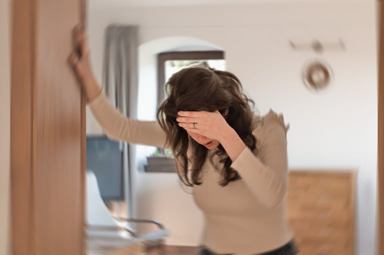 Woman suffering from vertigo or dizziness or other health problem of brain or inner ear